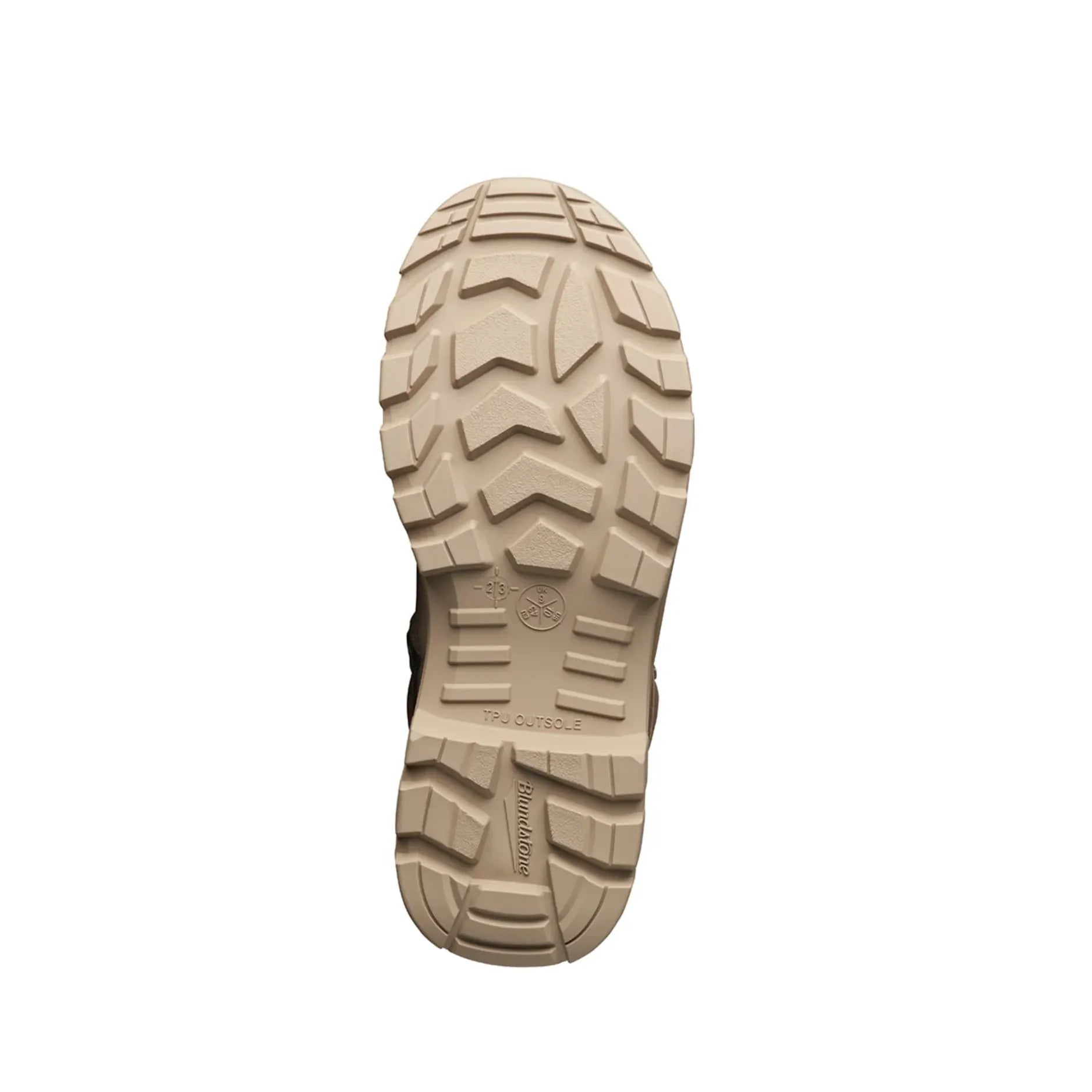 Close-up of a beige boot sole with tread pattern on a white background