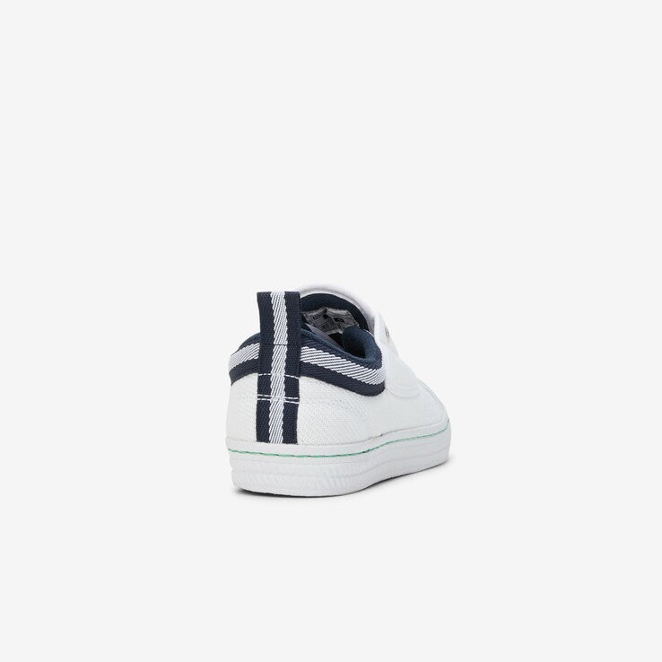 White canvas shoe with navy blue detailing, showcasing the back view of the Volley 600072 Classic Canvas, featuring a vulcanised sole and slip-resistant outsole.