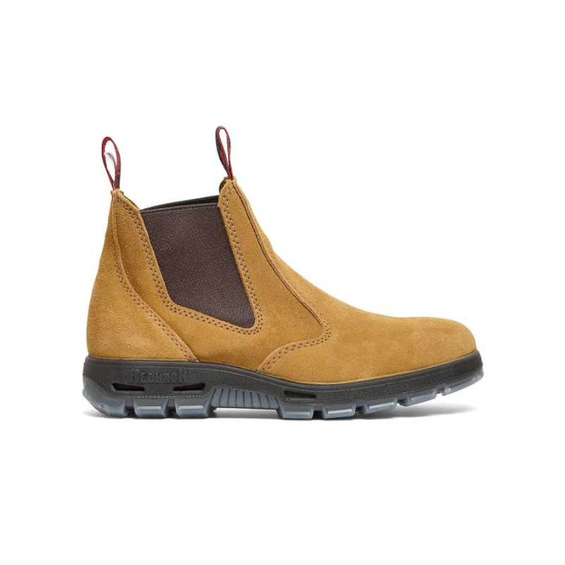 Tan Chelsea boot with black sole on a white background