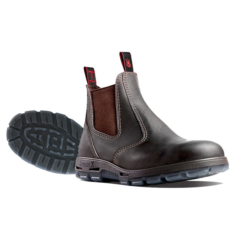 Pair of brown leather boots with black soles on a white background