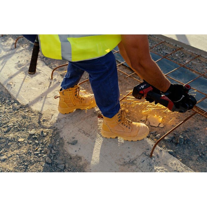 Blundstone 9090 Rotoflex wheat safety boots with zip side in construction setting.