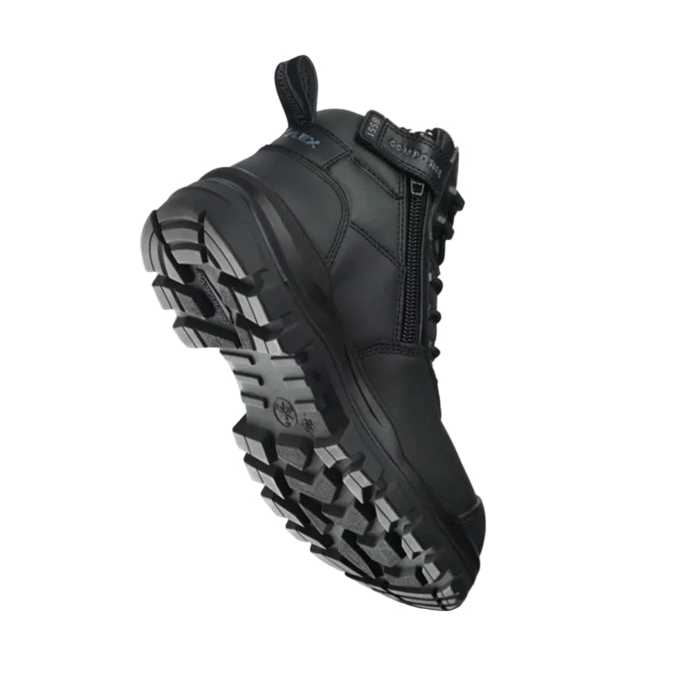 A black tactical ankle boot with a rugged treaded sole, shown floating at an angle against a light beige background.